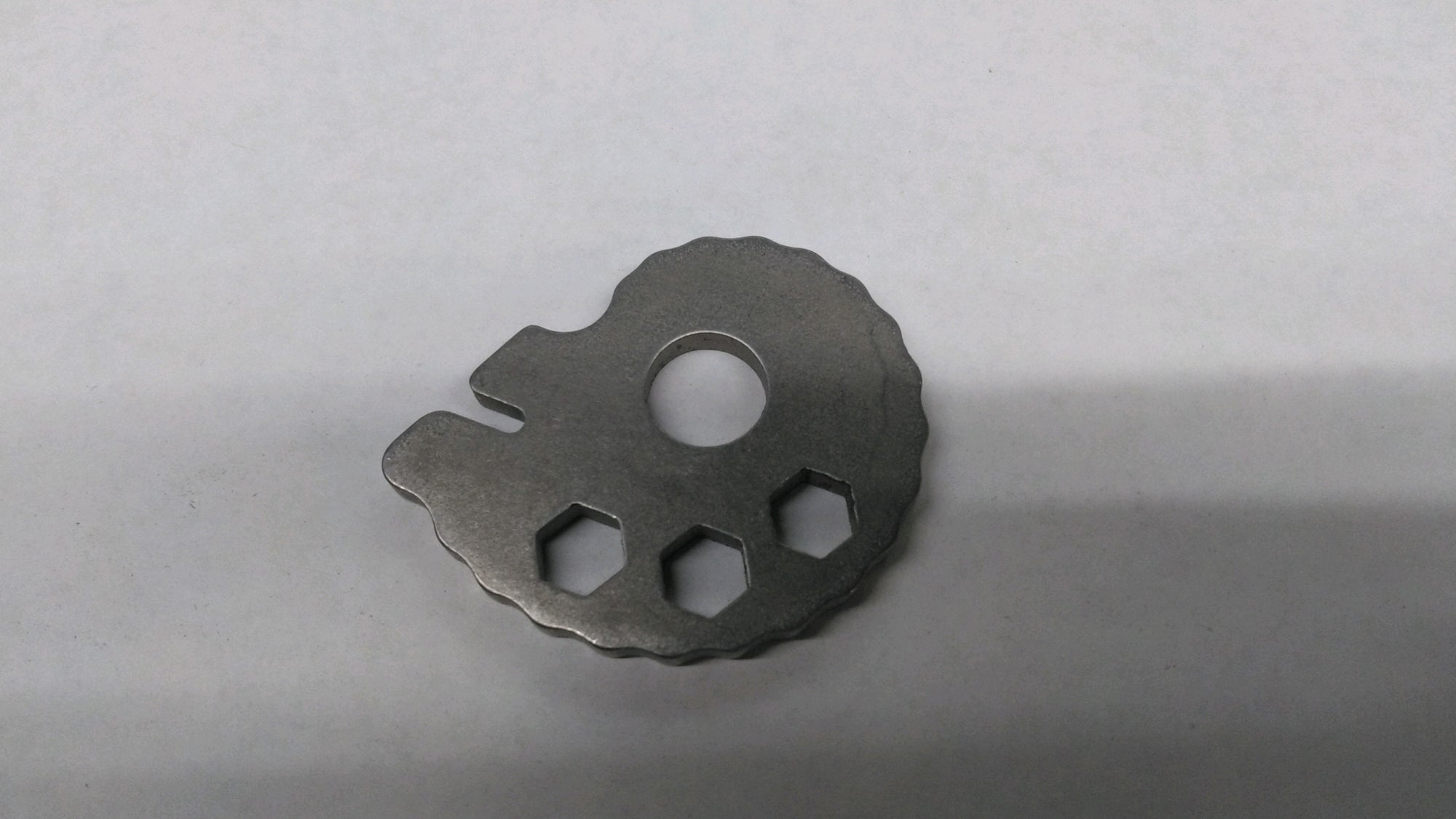 Chain tension adjuster